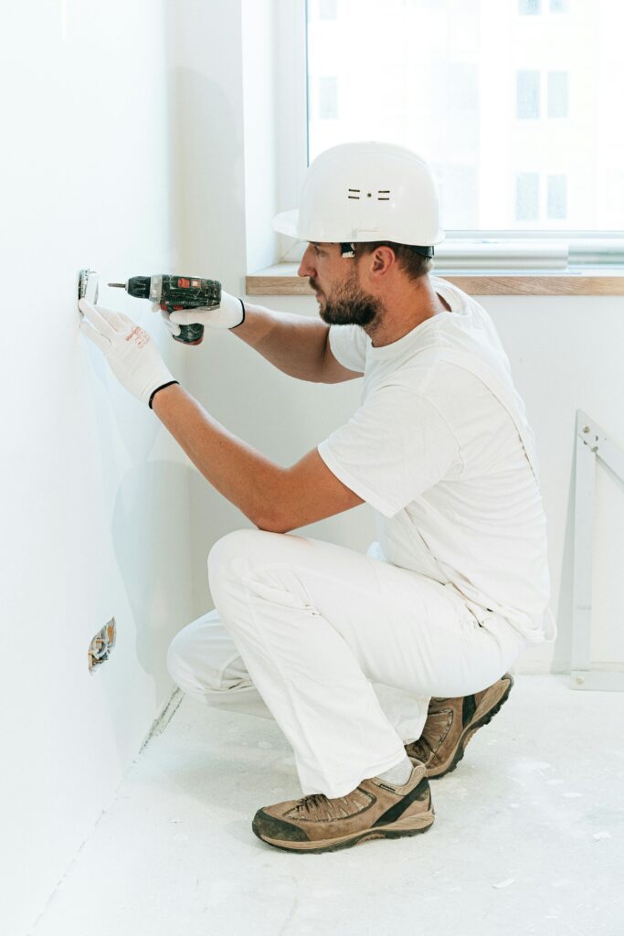 A man fitting the board | Electrician in Kaithal